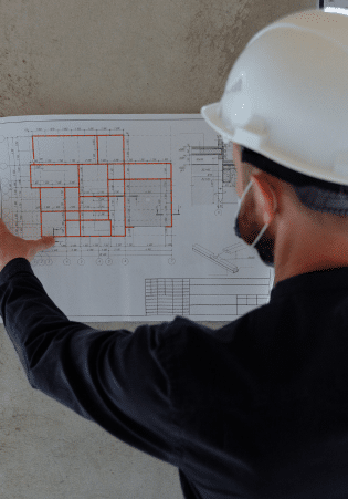 Building Engineer looking at plans