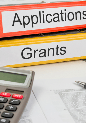 Grants and Applications Folders on Desk